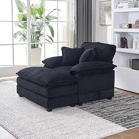 
Black wood frame chaise lounge with pillows in cozy reading corner
